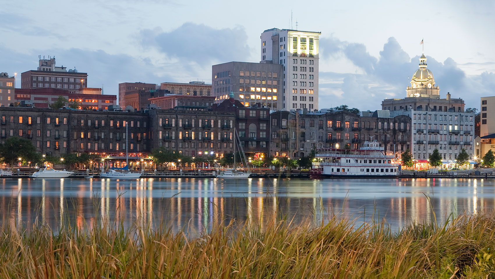 The Brice Hotel Savannah, GA. Image describes the Savannah skyline overlooking Riverwalk.